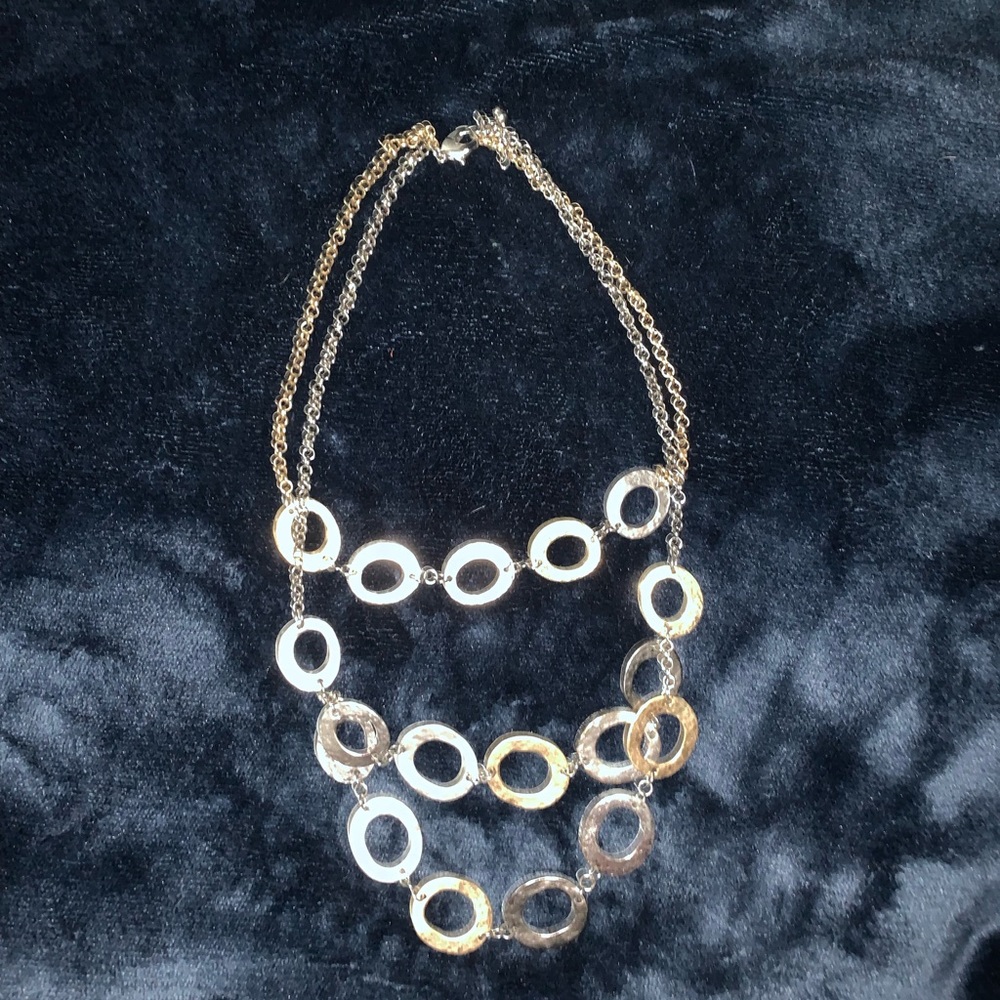 Triple graduated strands of gold and silver rings